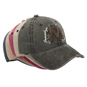 Faded cotton baseball cap with embroidered letter M in dark grey, beige, red and navy blue