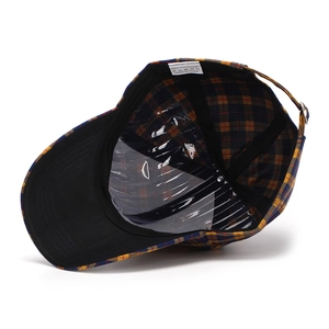 Detail view of plaid baseball cap interior with polyester lining and adjustable strap