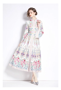 Detail of mandarin collar and button design on ethnic print long sleeve maxi dress