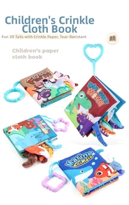 Detail of four baby cloth books with 3D animal tails and plastic hanging rings