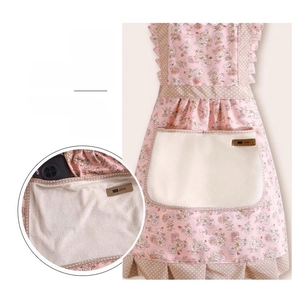 Detail of floral cotton apron with absorbent hand-wiping towel pocket for smartphones