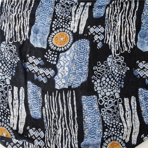 Detailed close-up of exotic vintage blue-and-white porcelain pattern on long scarf fabric
