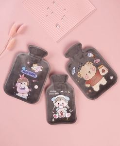 Flat lay of soft grey plush hot water bottles with cute cartoon bear and girl prints