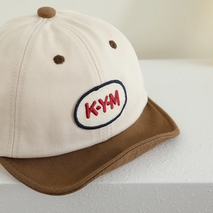 Kids baseball cap with beige and coffee color blocking and KYM letter embroidery