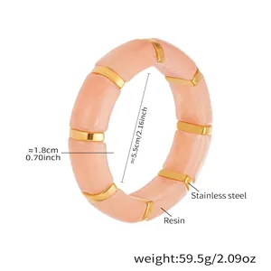 Detail view of pink resin segment bracelet with gold stainless steel ring spacers