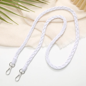 Close-up of white hand-woven crossbody phone strap with silver metal spring clasps