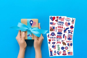 Detail of USA 250th Independence Day stickers on a gift box and flat lay set