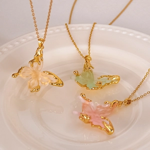 Exquisite gold butterfly necklaces with liquid-style resin pendants in three soft colors