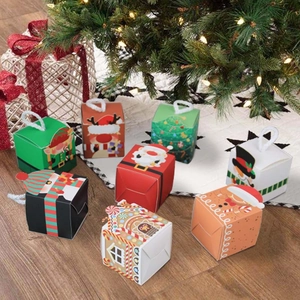 Small 5.5cm square Christmas gift boxes with Santa and reindeer designs on wood floor