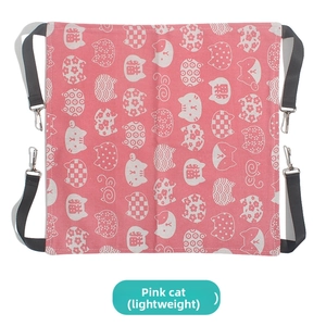 Detail view of pink cat hammock fabric with adjustable straps and metal carabiner clips