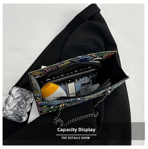 Detail showing the multi-layer interior capacity of the snake pattern crossbody bag