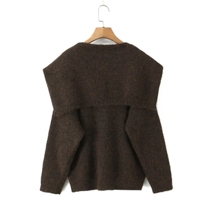 Detail of dark brown knit sweater with fuzzy texture and oversized sailor collar design