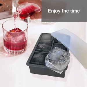 Detail of 6-grid black silicone ice tray with lid producing large square cubes