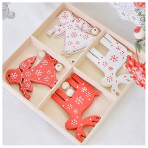 Macro detail of red and white wooden Christmas ornaments with snowflakes in a gift box