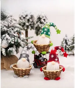 Close-up of three Christmas gnomes sitting in woven bamboo baskets for festive storage
