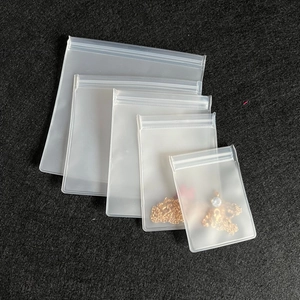 Frosted EVA ziplock storage bags for jewelry in multiple sizes on black background