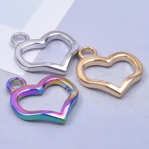 Polished heart-shaped hollow pendants in gold, silver, and rainbow steel for DIY jewelry