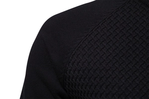 Close-up of black men's cotton knit sweater featuring refined waffle texture and stitching