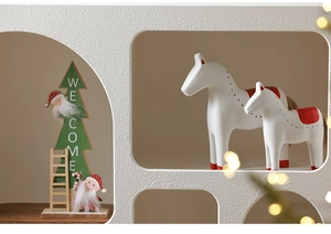Detail of wooden Christmas tree decoration with Welcome sign and Santa Claus figurine
