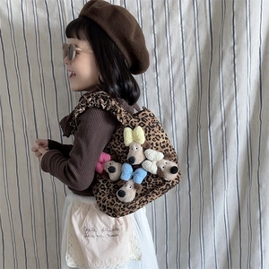 Girl's leopard print shoulder bag with colorful bows and a cute plush dog pendant