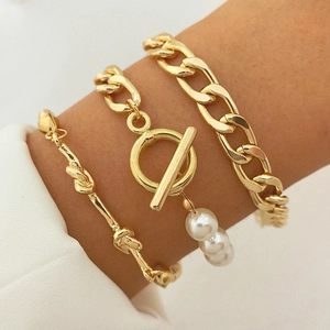 Three-piece gold layered bracelet set with Cuban chain, OT clasp and pearl pendant
