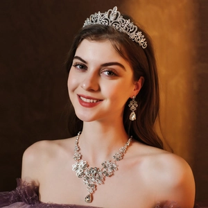 Luxurious silver bridal jewelry set with crystal tiara, necklace and earrings for wedding