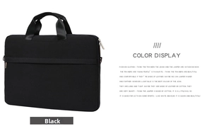 Front view of black minimalist laptop bag showing handles and zippered pocket compartment