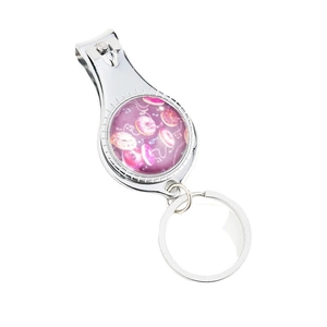 Creative metal nail clipper keychain with pink donut pattern on a minimalist white background