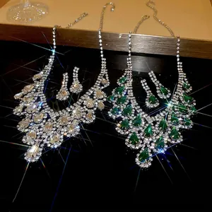 Luxury rhinestone tassel necklace and teardrop earrings set with emerald green stones