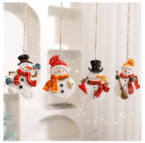 Hanging set of four matte resin snowman ornaments with festive warm indoor string lighting