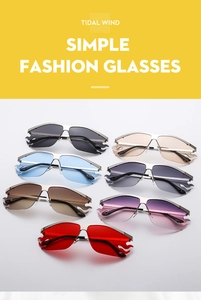 Detail view of flame-shaped rimless sunglasses in multiple gradient color options