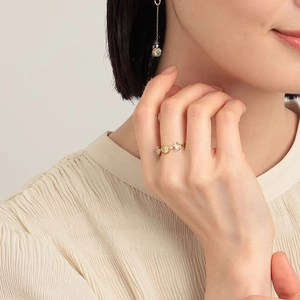 Detail of 925 sterling silver gold plated ring with natural prehnite stones and small zircons