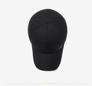 Overhead view of a black winter baseball cap with reinforced stitching and metal plate
