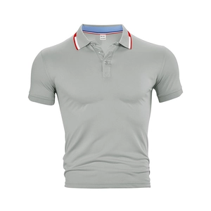 Close-up of polo shirt collar with red, white and blue trim and 100% polyester tag