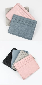 Close-up of litchi pattern leather card holder with 3 slots and fine stitching details