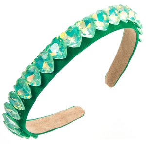Detail of emerald green satin headband with iridescent crystal hearts on white background