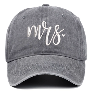 Macro detail of 'mrs.' white embroidery with red heart on vintage grey baseball cap