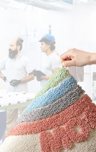 Detail of durable non-shedding rainbow bath mat showing reinforced stitching and soft fiber