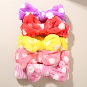 Five-pack plush polka dot bow headbands in purple, red, yellow and pink for face washing