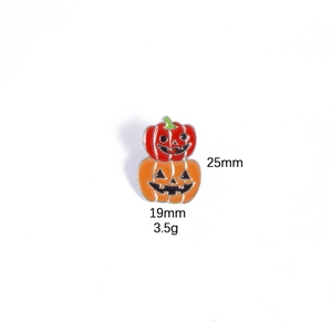 Detail view of Halloween pumpkin enamel pin showing dimensions 25mm height and 19mm width