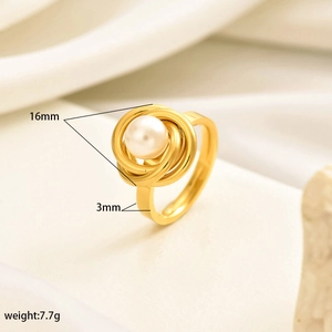 Detailed view of the luxury gold pearl ring showing 16mm swirl diameter and 3mm band width