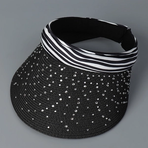 Detailed view of sun visor hat with zebra stripe band and sparkling rhinestone embellishments