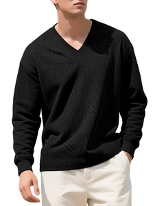 Detailed view of black V-neck sweater with vertical geometric jacquard and cable knit texture