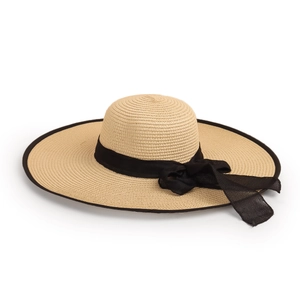 Detail of hand-woven straw hat with large brim and elegant black mesh bow ribbon