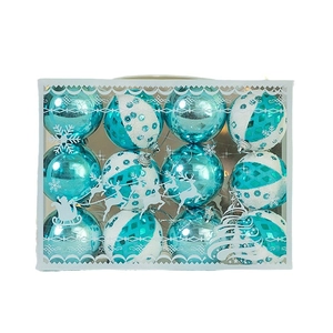 Blue and white Christmas ball ornaments set with glitter and patterns in a gift box