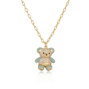 Detail of 18K gold-plated bear pendant necklace with sparkling white zircons and blue beads
