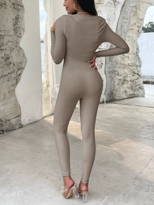 Back view of khaki ribbed knit long sleeve yoga jumpsuit showing slim fit and back design