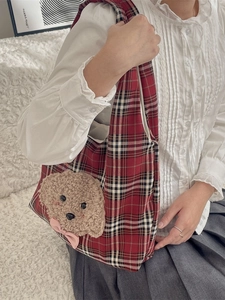 Cute red plaid shoulder bag featuring 3D fluffy teddy dog and bow, lifestyle view