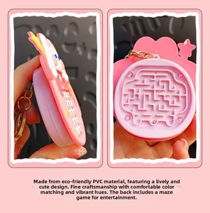 Pink rabbit keychain featuring a mini back-panel maze game with a metal ball