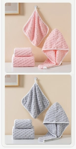 Close-up of pink and grey coral fleece towels with honeycomb texture and white edges